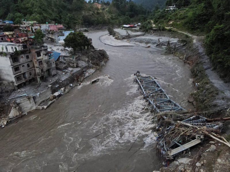 A drone view of a broken bridge and damaged houses after the flash floods and mudslide, at Devighat, Nuwakot district, Nepal, Aug. 28, 2026. (OSV News photo/Francis Mascarenhas, Reuters)