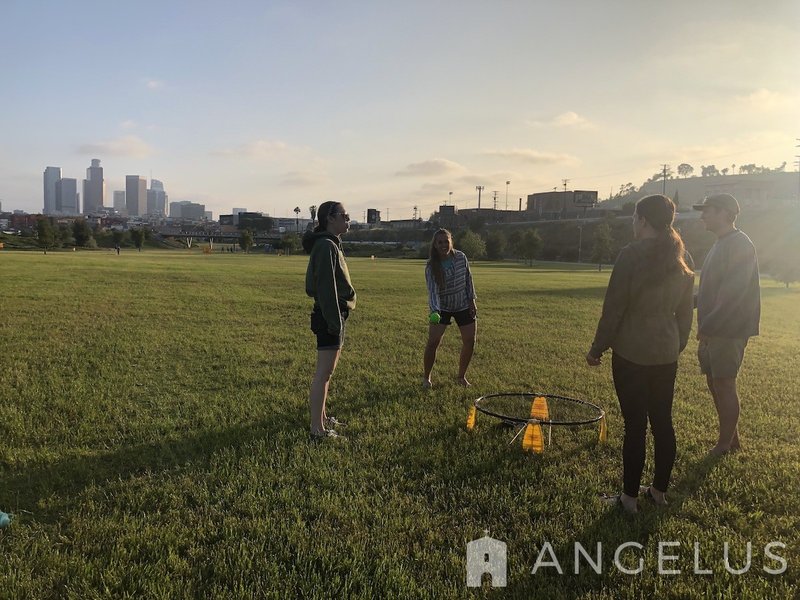Missionaries enjoying a night of community in the park. COURTESY CHRIST IN THE CITY