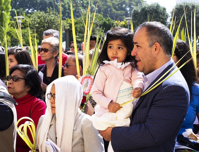 Faithful enter the Cathedral of Our Lady of the Angels during the Palm Sunday procession at the start of Mass on April 14. VICTOR ALEMÁN/ANGELUS NEWS