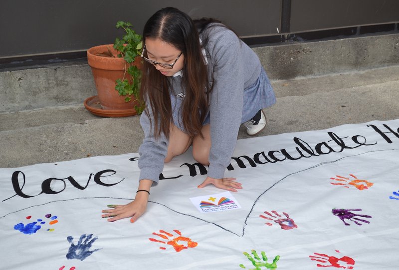 Students from Immaculate Heart High School and Middle School in Los Feliz launched Catholic Schools Week by sharing what they love about their school — and their handprints — on a giant poster created by the high school's Associated Student Body and Ministry Team. Among the many inscriptions, "loving friends" and "supportive community" appeared multiple times.  CALLIE WEBB