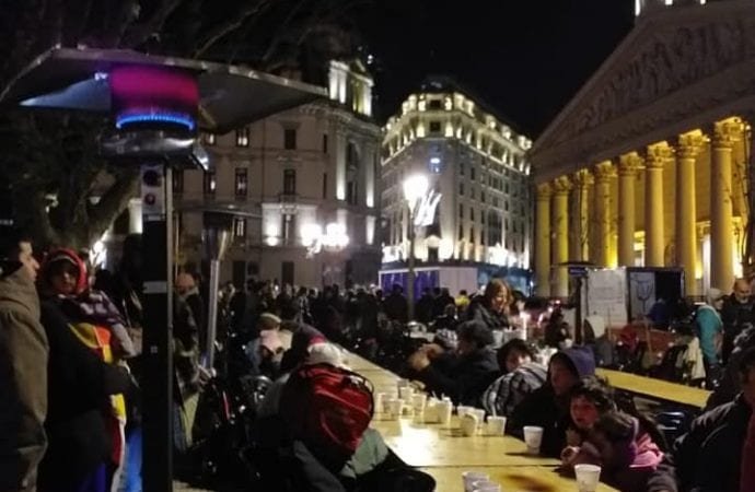 Some 350 people receive a warm meal in Plaza de Mayo