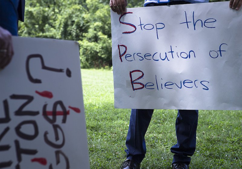 A participant holds a sign at a Religious Freedom Rally in Washington July 10