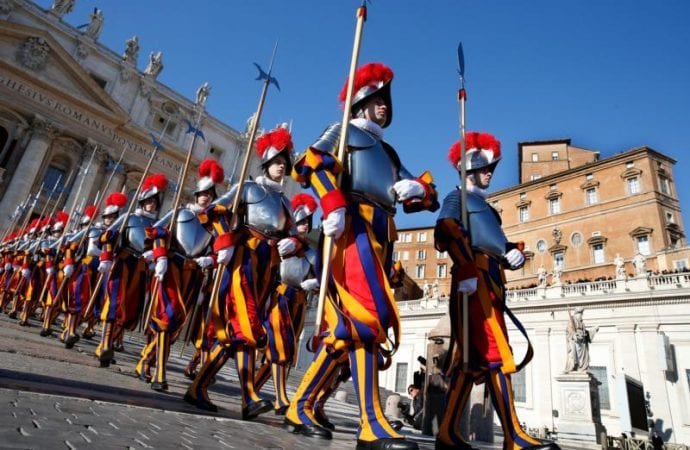 Swiss Guards march in St. Peter's Square at the Vatican Dec. 25