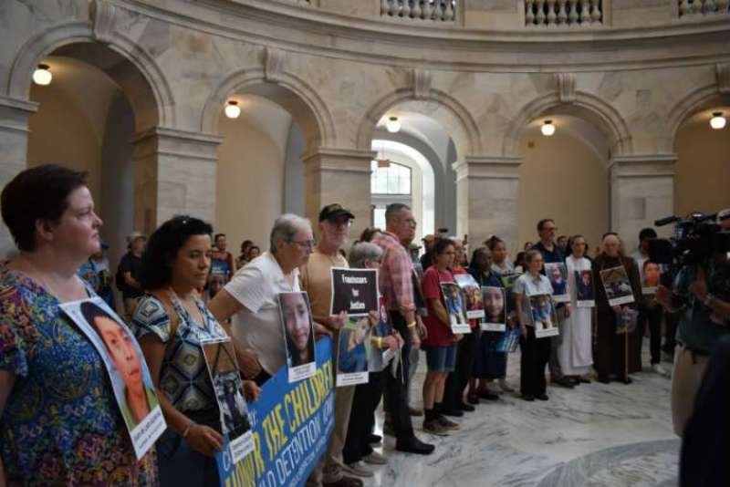 Demonstrators during a "Catholic Day of Action" gather in the Russell Senate building on Capitol Hill