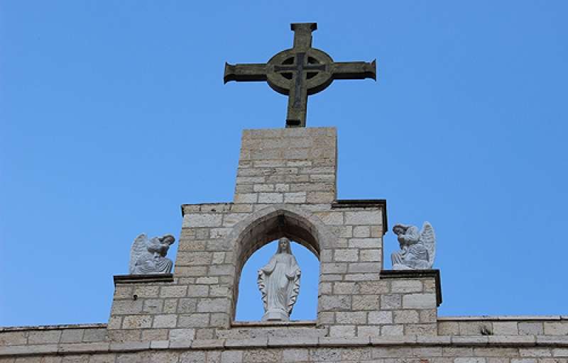 A cross atop the seminary in Beit Jala