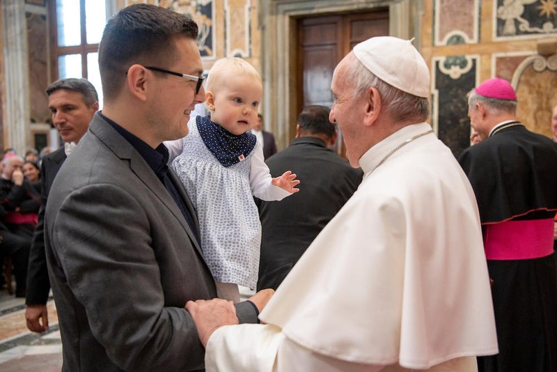 Pope Francis greets family members during an audience with participants attending an international conference of pro-life and medical leaders