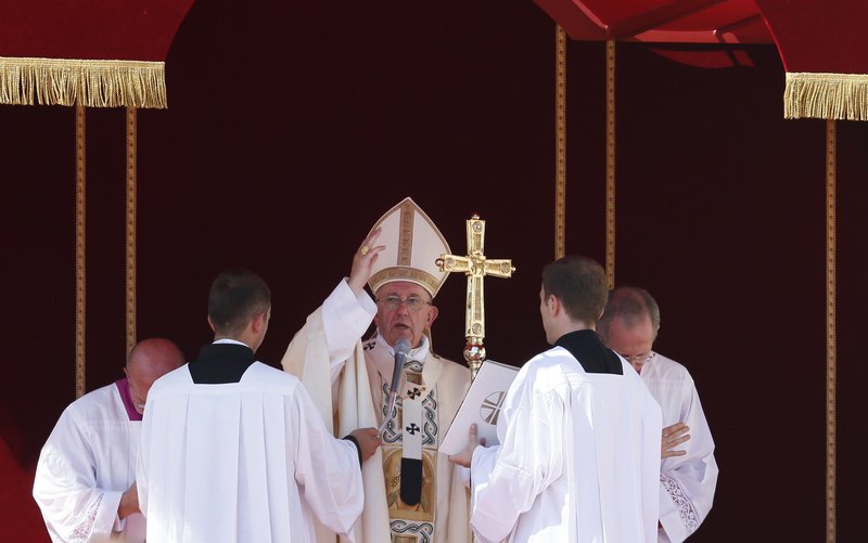 Pope Francis delivers his blessing at the conclusion of the canonization Mass of St. Teresa of Kolkata in St. Peter's Square at the Vatican Sept. 4. (CNS photo/Paul Haring)