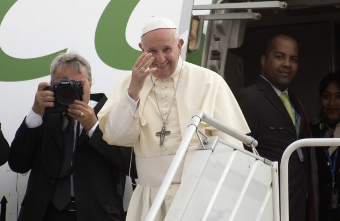 Pope Francis waves goodbye as he boards the plane for Rome at the end of his three-nation African tour at Antananarivo's International Airport