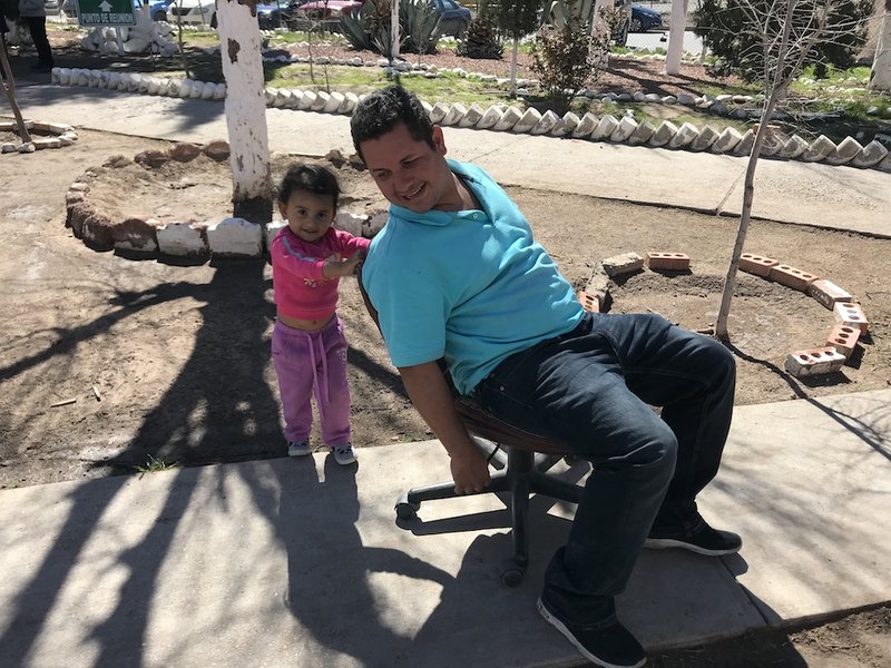 Rodny Pineda plays with his niece