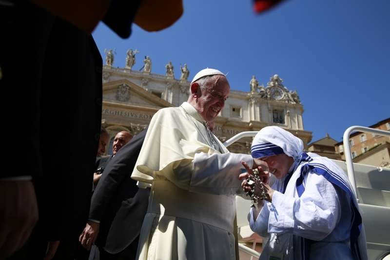 Pope Francis meets a Missionary of Charity at the canonization Mass of Mother Teresa Sept. 4