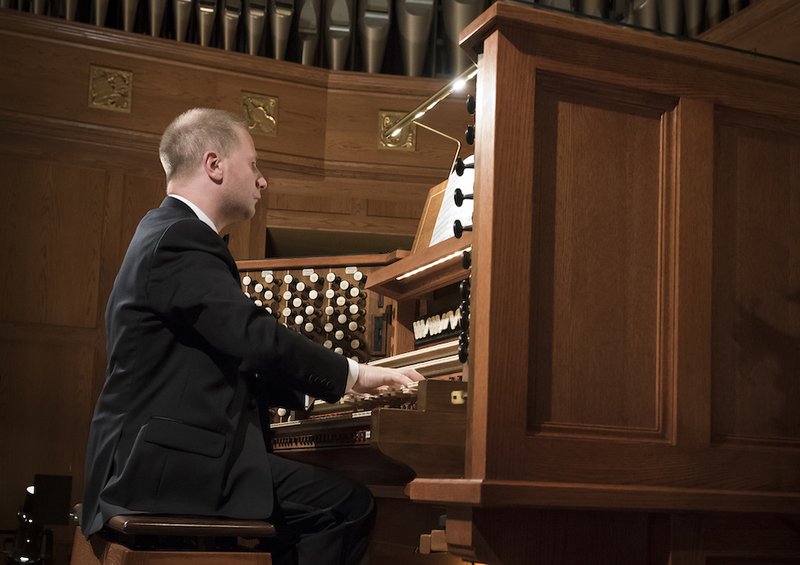 Organist Johann Vexo of Paris performs during a benefit concert April 26