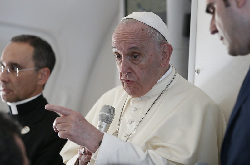 Pope Francis answers questions from journalists aboard his flight from Abu Dhabi