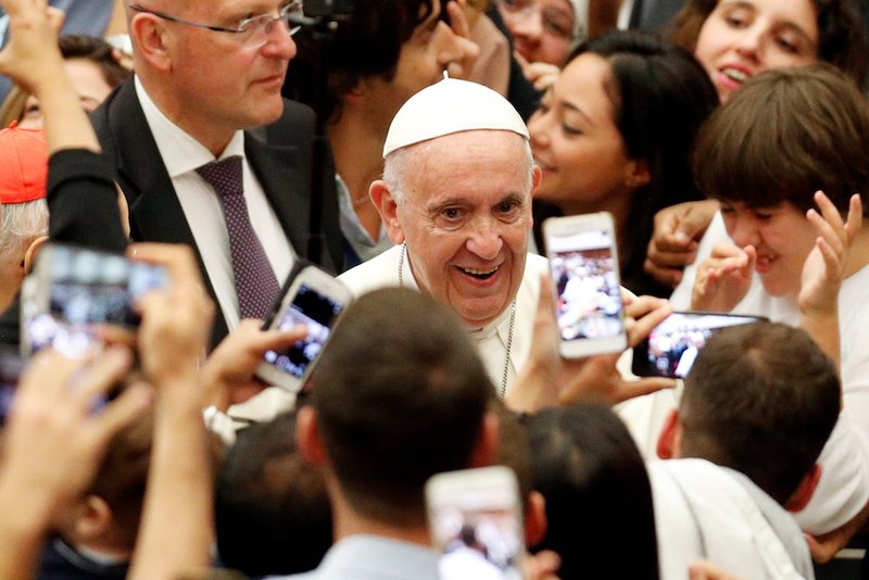 Pope Francis arrives for a gathering with young people and members of the Synod of Bishops at the Vatican Oct. 6. (CNS photo/Alessandro Bianchi