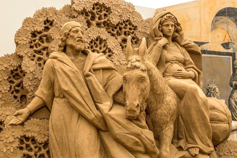 A depiction of Mary and Joseph's journey to Bethlehem sculpted from sand is displayed in the Italian resort town of Jesolo in December 2017. Jesolo will donate a 52-foot wide Nativity scene made entirely of highly compressed sand to the Vatican. The sculpture will be unveiled during the Vatican's annual tree lighting ceremony Dec. 7. (CNS photo/Jesolo Tourism Office)