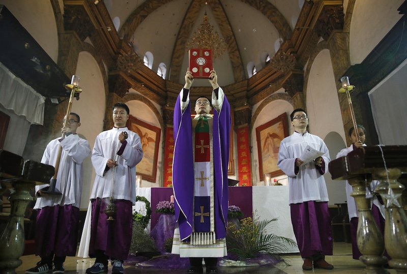 A Catholic priest celebrates Sunday Mass in Beijing in this 2016 file photo. In a special message addressed "to the Catholics of China and to the universal church