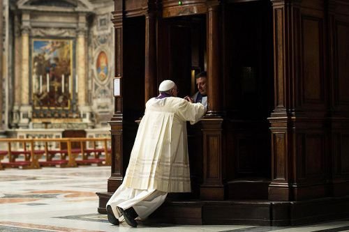 Pope Francis goes to Confession during a penitential celebration at St. Peter's Basilica