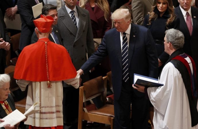 U.S. President Donald Trump greets Cardinal Donald W. Wuerl of Washington during an interfaith prayer service at the National Cathedral in Washington Jan. 21