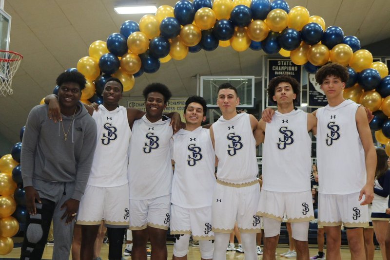 St. John Bosco's basketball team celebrates their win (PHOTO COURTESY BOSCO BASKETBALL TWITTER)