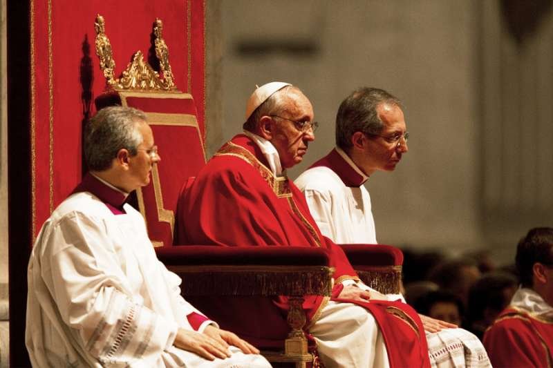 Pope Francis praying during an evening Good Friday service in St Peter's Basilica
