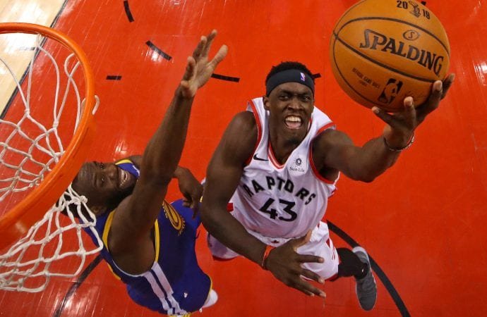 Toronto Raptors forward Pascal Siakam (43) shoots the ball against Golden State Warriors forward Draymond Green (23) in game one of the 2019 NBA Finals at Scotiabank Arena in Toronto May 30