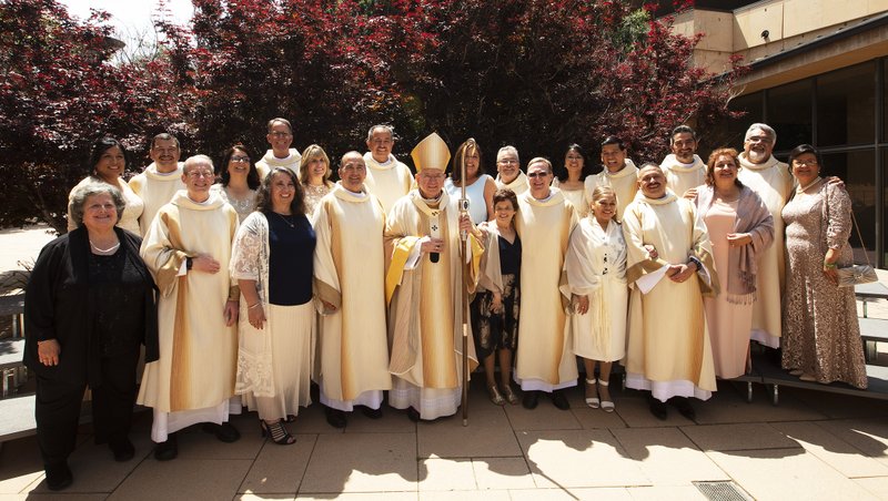 The 2019 ordination class poses with Archbishop Gomez after the end of its ordination Mass. (Victor Alemán/Angelus)