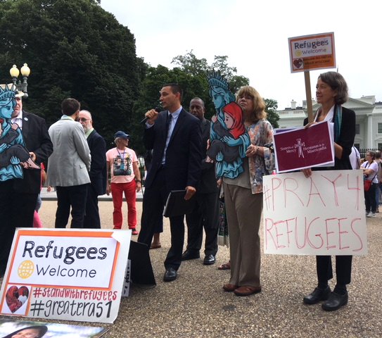 Catholics join other religious organizations and groups near the White House in Washington Sept. 12 urging the administration to allow 75