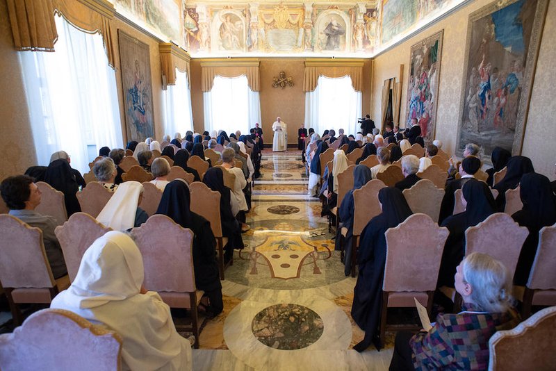 Pope Francis speaks during a Sept. 8 meeting with a group of Benedictine sisters at the Vatican. Forming a community of women from different backgrounds and uniting them in prayer