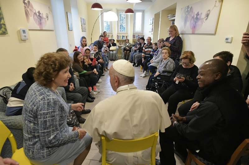 Pope Francis visits with residents of CasAmica