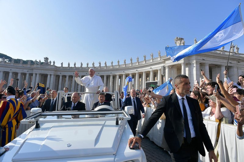 Pope Francis greets pilgrims as he arrives for his general audience in St. Peter's Square at the Vatican Sept. 18, 2019. The Catholic Church will endure, despite the frailty and sins of its members, because it is God's project, Pope Francis said during the audience. (CNS photo/Vatican Media)