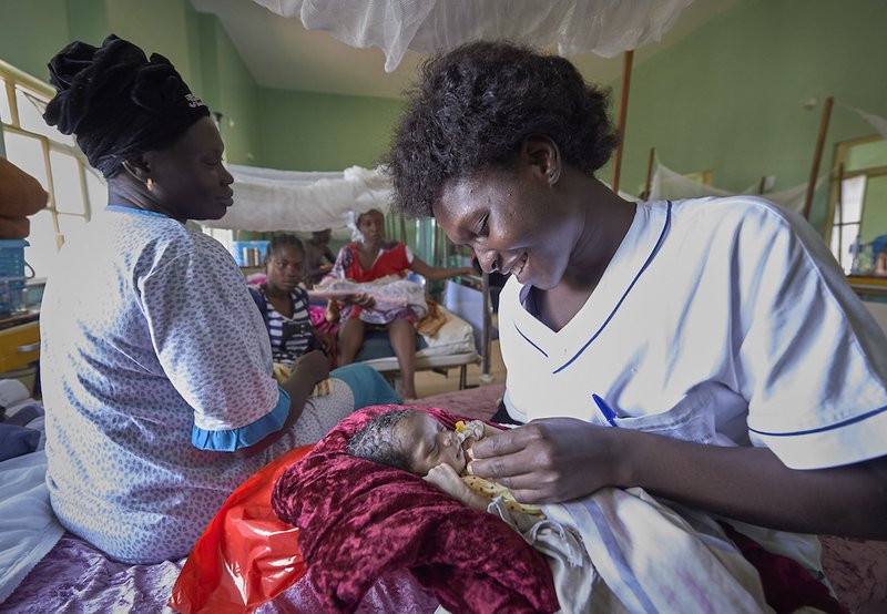 Nurse Annet Kojo feeds a 4-day-old baby girl in the maternity ward of the St. Daniel Comboni Catholic Hospital in Wau