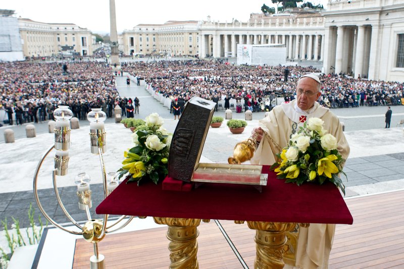 Pope Francis uses incense to bless a bronze reliquary containing the relics of St. Peter the Apostle during a Mass concluding the Year of Faith in St. Peter's Square at the Vatican Nov. 24