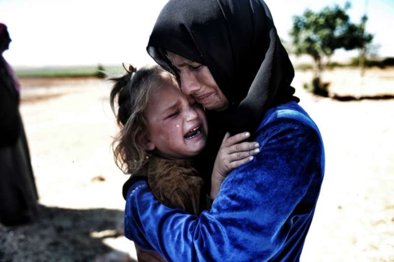 Refugees flee the Syrian Civil War in 2015. Credit: quetions123 / Shutterstock.