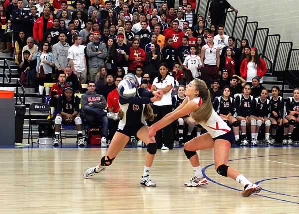 The Knop sisters — senior Caroline (left) and sophomore Katherine — combine for a dig