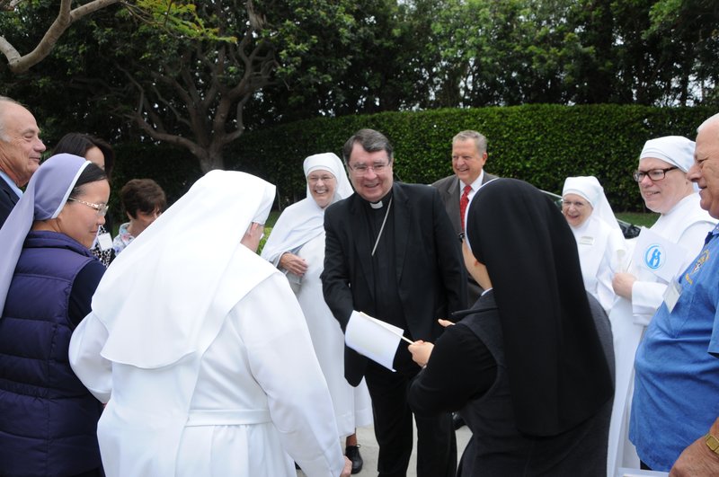 Papal nuncio to the U.S. Archbishop Christopher Pierre is greeted by residents at the St. Jeanne Jugan Home