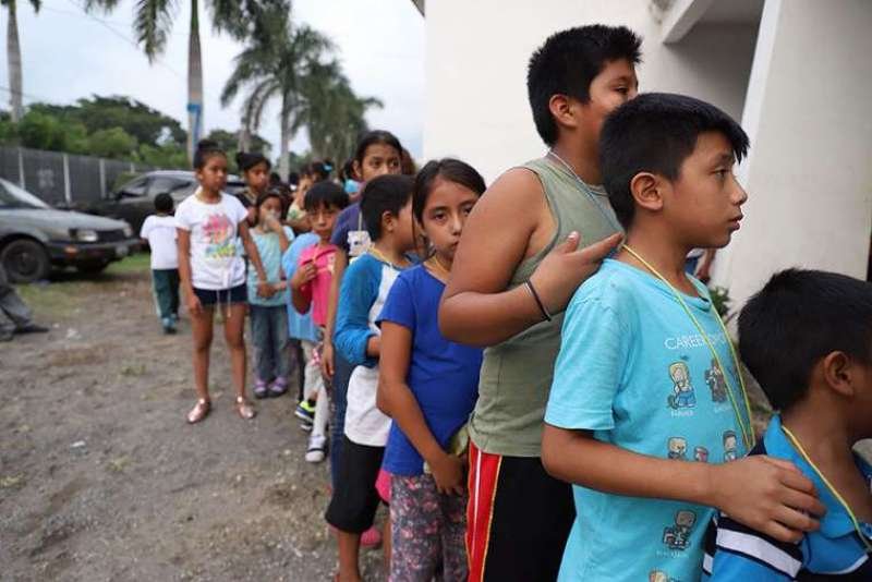 Children queue outside a shelter in Guatemala. Credit: Ivan Palma/Catholic Relief Services.