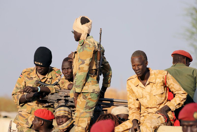 Armed members of the South Sudanese security forces are seen in Bentiu Jan. 21