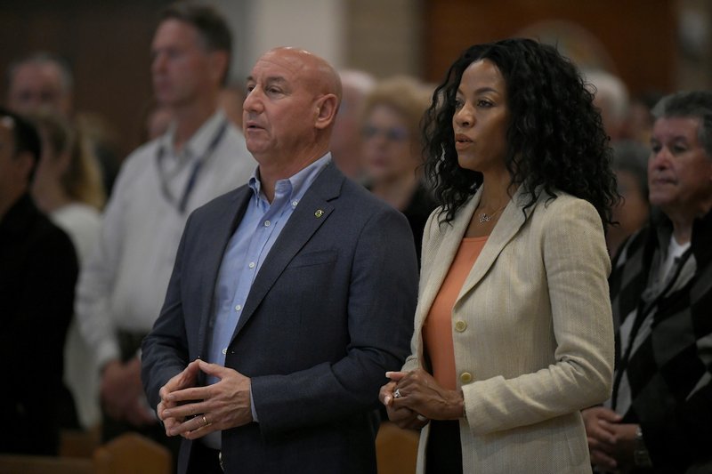Thousand Oaks Mayor Andrew Fox and his wife Letitia attend a prayer vigil at Saint Paschal Baylon Church on November 8