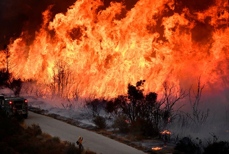 Firefighters battle a massive wildfire Dec. 10 near Ojai