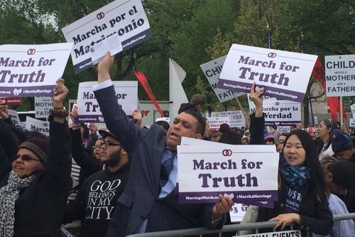 Crowds hold signs in defense of traditional marriage at the March for Marriage in Washington