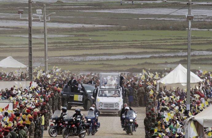 Pope Francis arrives with the popemobile to celebrate a Mass in Antananarivo