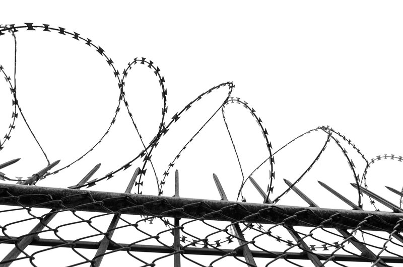 Behind "Prison on Parole."
