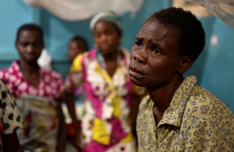 A victim of ethnic violence rests inside a hospital in Bunia