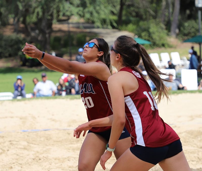 Jessie Prichard (20) and Sara Kovac (11) teamed to help LMU’s beach volleyball team win the conference championship April 20. (LMU ATHLETICS)