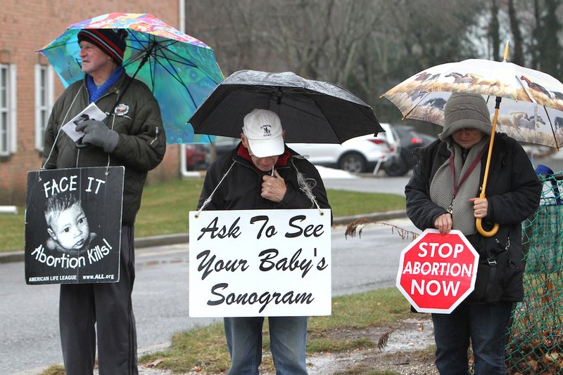 Pro-life advocates gather in silent witness near the entrance of a Planned Parenthood center in 2018 in Smithtown