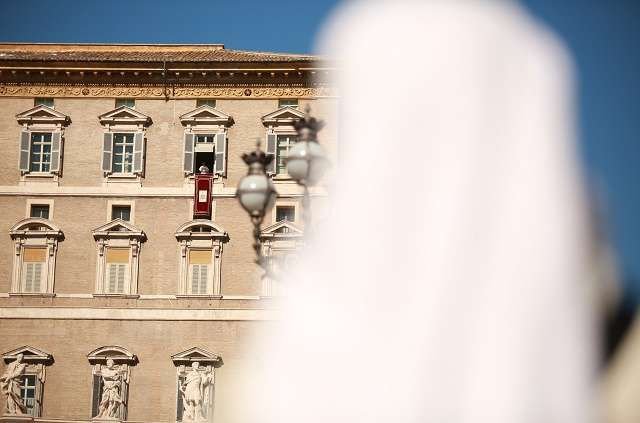 Pope Francis addresses the crowd during the Angelus Feb. 19