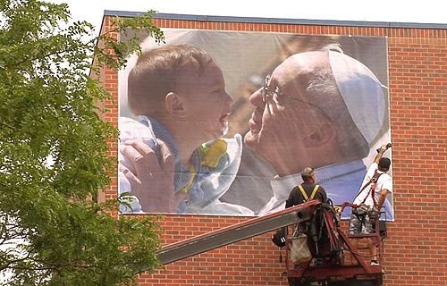 A Pope Francis banner is hung at the Samaritan House homeless shelter in Denver. Credit: Catholic Charities of Denver.