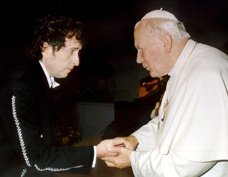 Pope John Paul II greets American singer-songwriter Bob Dylan in 1997 after he performed in a concert during a Catholic Youth rally in Bologna