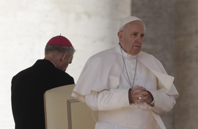 Pope Francis stands at the end of the weekly general audience in St. Peter's Square at the Vatican