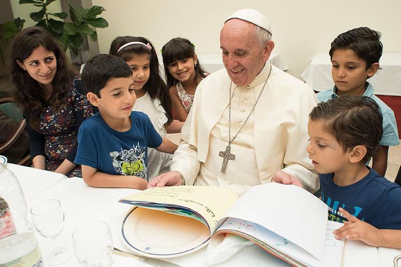 Pope Francis hosts a lunch with Syrian refugees at his residence in Vatican City
