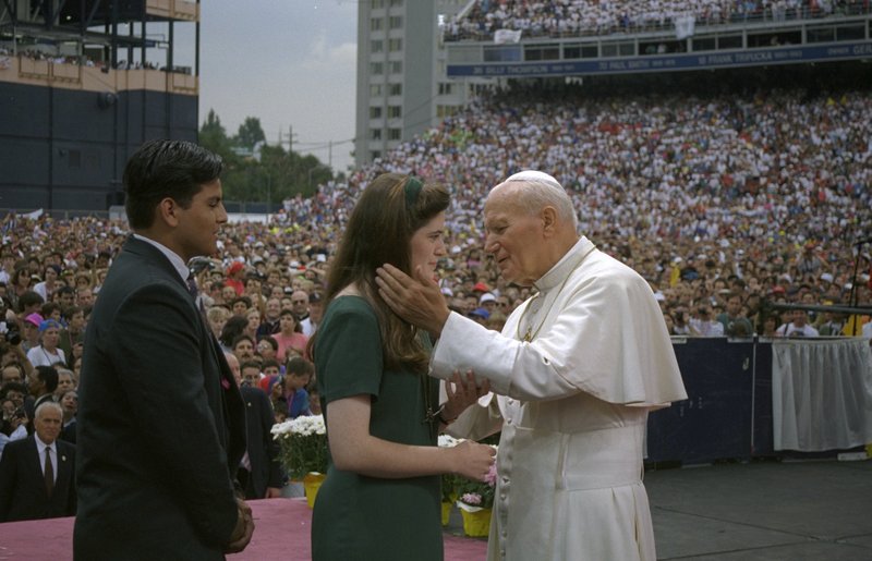 Pope John Paul II greets young people at Denver's Mile High Stadium during World Youth Day in 1993. (CNS photo/Joe Rimkus Jr.)